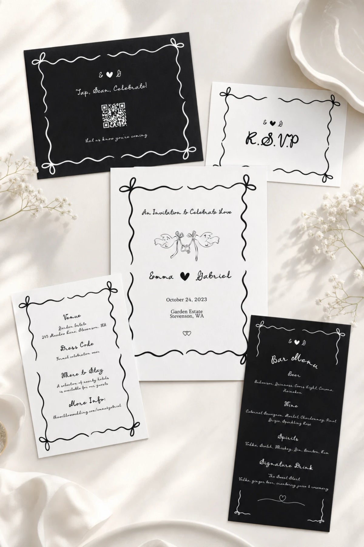 Ribbon & Ink hand-drawn wedding invitation suite in black and white, styled on silk with baby's breath